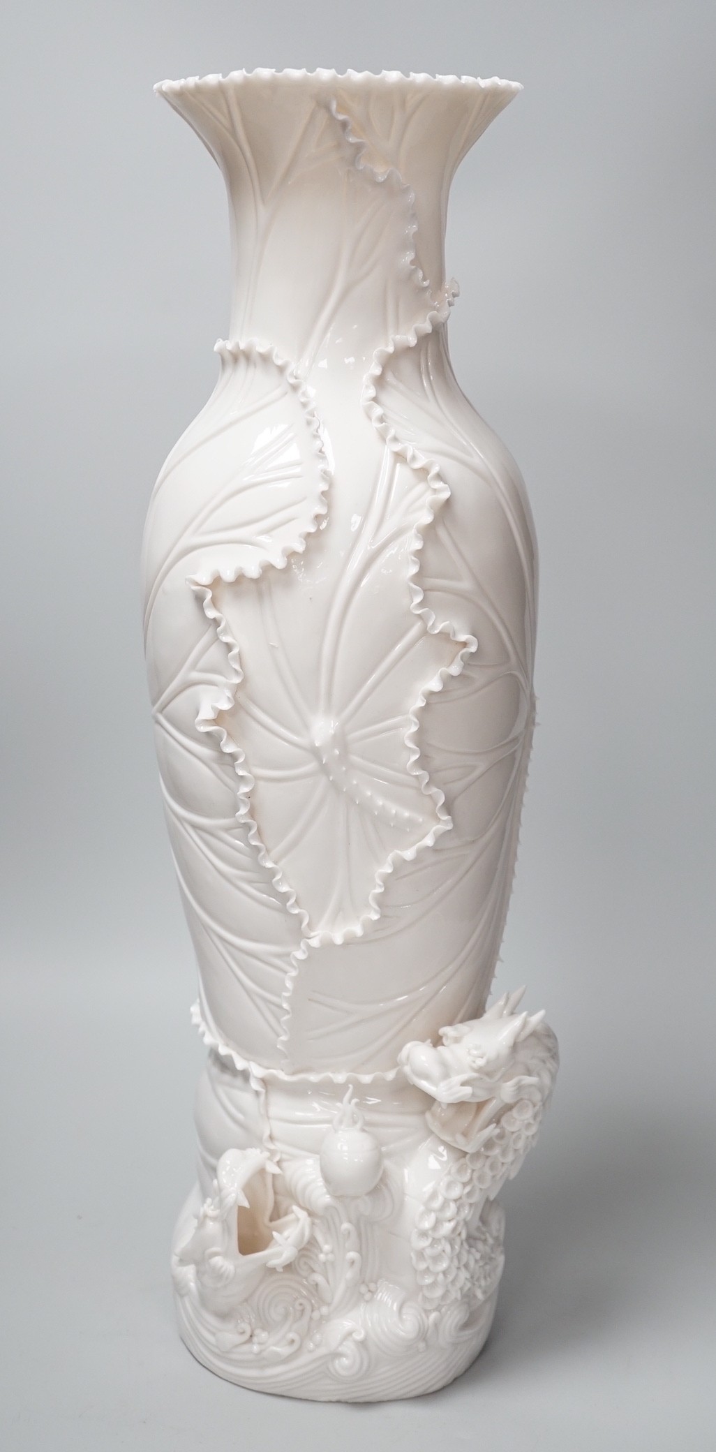 A cased Chinese blanc de chine ‘dragon’ vase. 49cm high